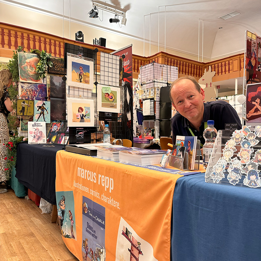 Marcus Repp an seinem Stand beim Comic-Salon Erlangen 2024.